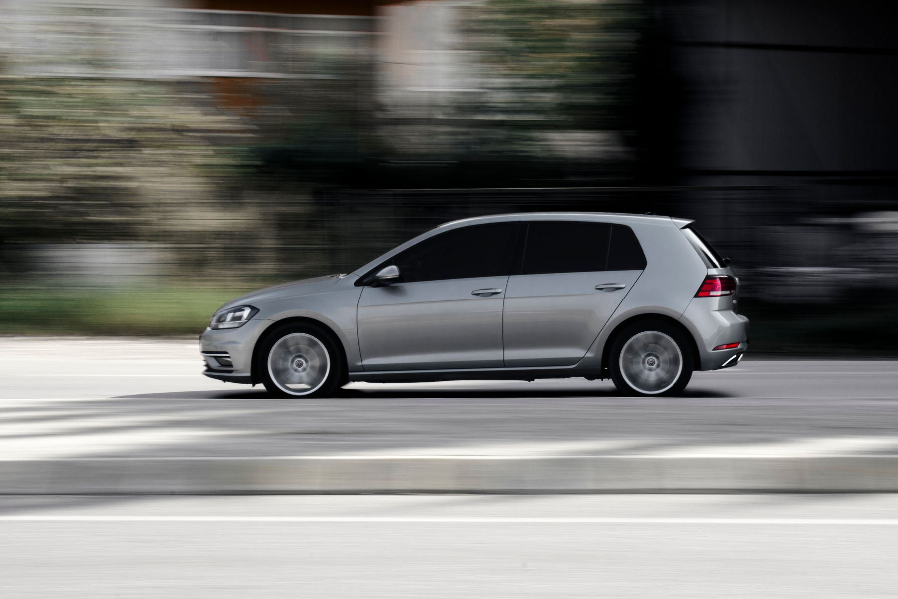 Silver five-door hatchback in side profile