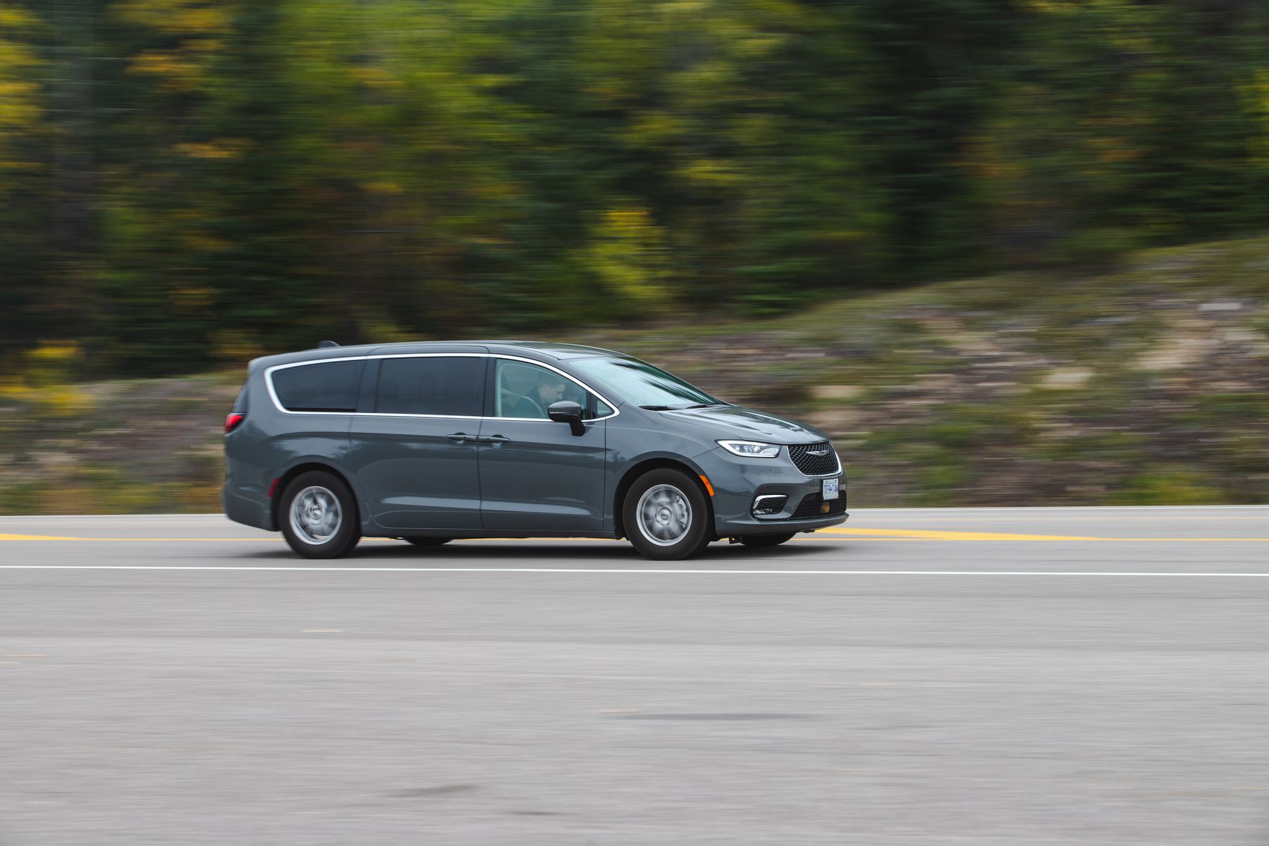 Gray Chrysler Pacifica minivan in motion