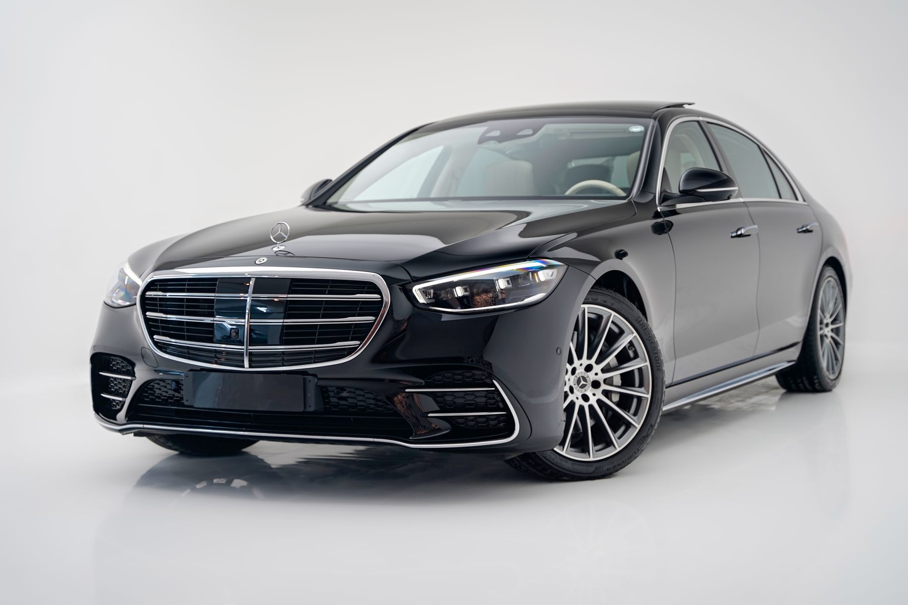 Black Mercedes-Benz S-Class sedan in a studio